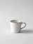 White handmade coffee cup made of white glaze stoneware